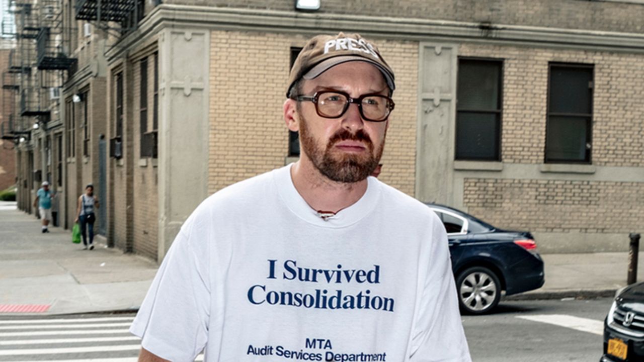John Wilson in a cap and t-shirt